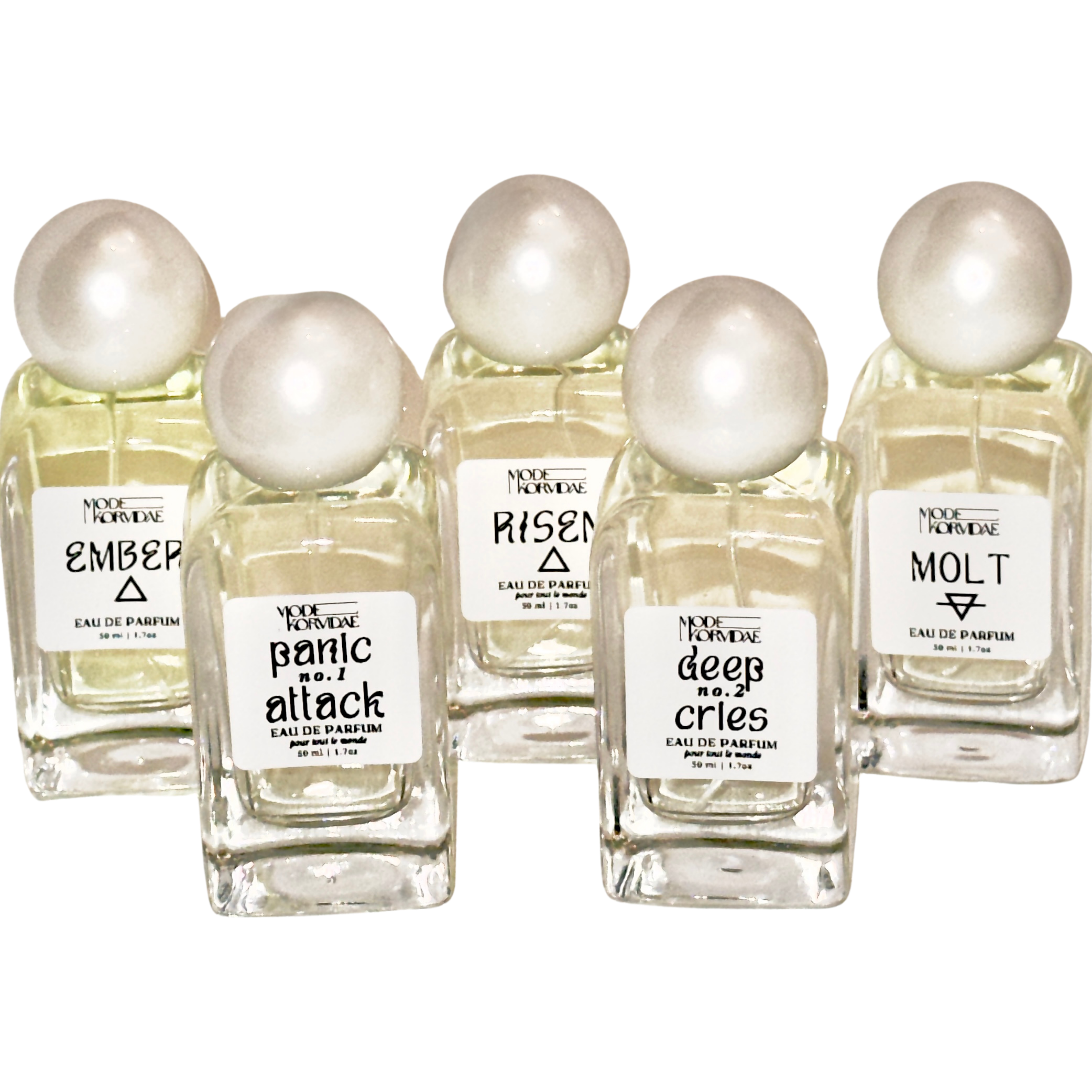 Group of perfume bottles with pearl lids